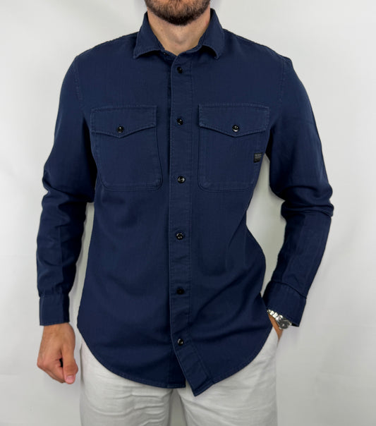 Chemise en jean G-Star homme taille L en très bon état. Pièce seconde main premium sélectionnée par Comptoir Masculin. Expédition rapide depuis la France.