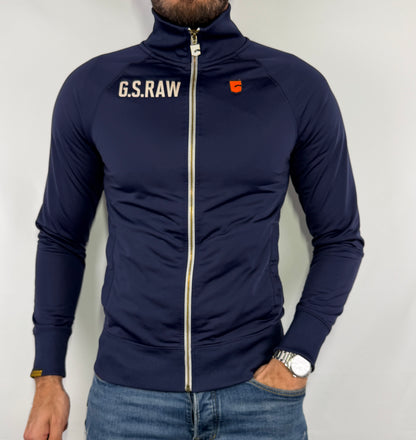 Veste G-Star bleu marine homme taille S en parfait état. Pièce seconde main premium sélectionnée par Comptoir Masculin. Expédition rapide depuis la France.